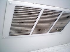 Image of a soffit vent with a seres of small holes drilled into the soffit.